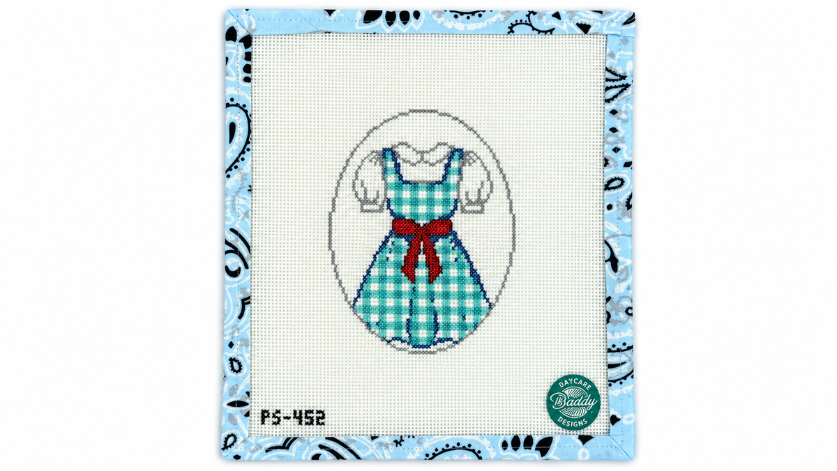 Shop Dorothy Dress by The Painted Stitch: a blue gingham dress and ruby red bow on 18 mesh. 5.5" x 4" needlepoint design. Threads not included.