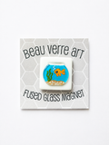 Shop the Beau Verre Goldfish Needleminder — adorable handcrafted glass art with strong magnetic hold. A charming gift for needlepoint enthusiasts. Each piece unique.