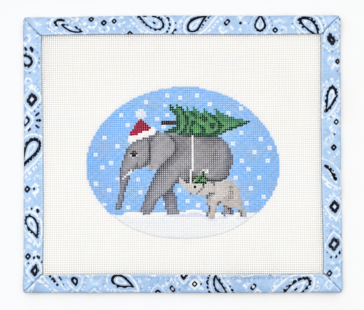 Stitch CBK's Elephants Bringing Home the Tree needlepoint ornament canvas. 18 mesh, 5 x 4 inches. Create a festive keepsake. Threads not included.