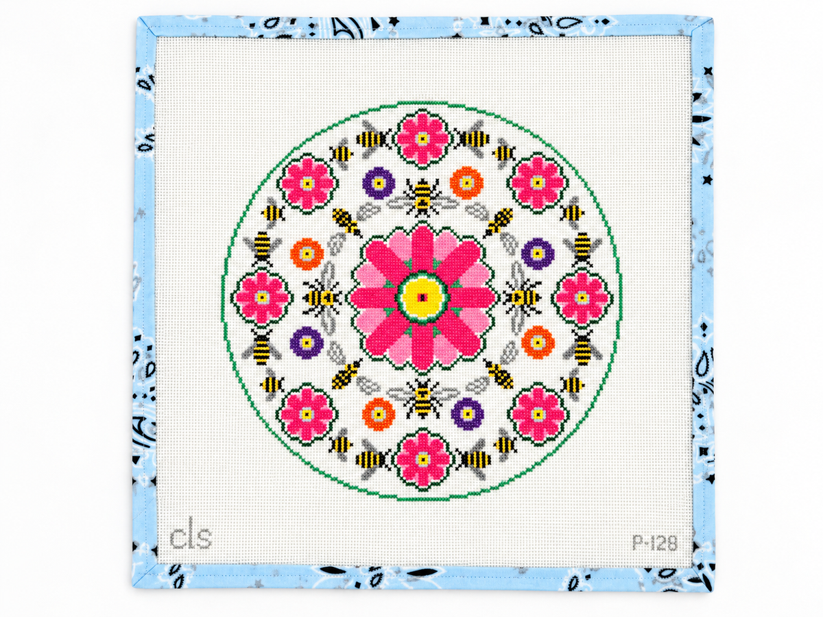 Stitch your own accent pillow with the Doolittle circular 10” pillow needlepoint canvas on 13 mesh. Threads not included.