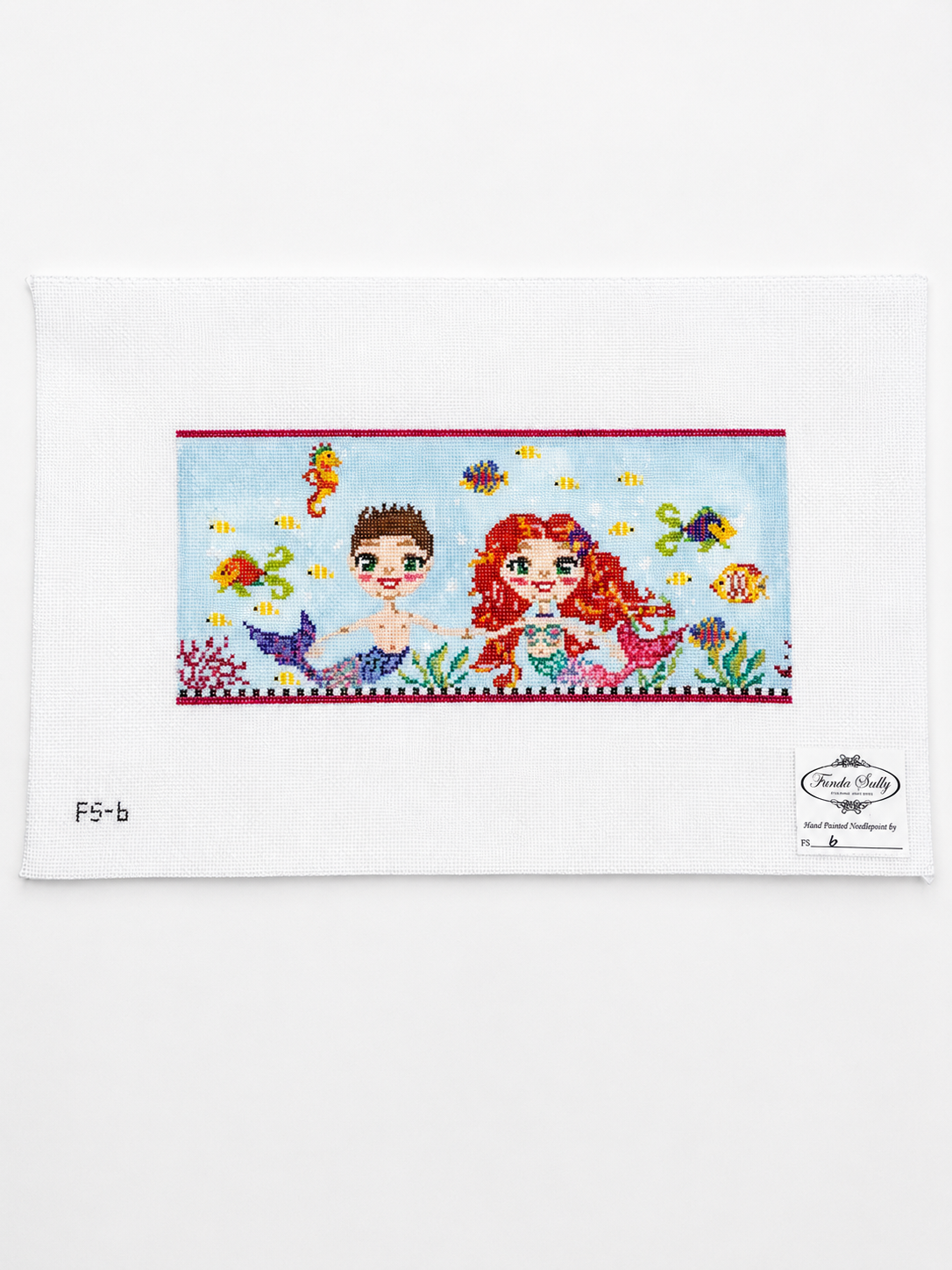Shop the Funda Scully Merkids 18-mesh needlepoint canvas, 4.25" x 9.75". Hand-painted artisan design, sold unthreaded and unstitched.