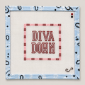 Hand-painted "Diva Down" needlepoint canvas by Sunday Shoppe. 18 mesh, 4x4" design. Threads not included. Shop premium quote canvases.