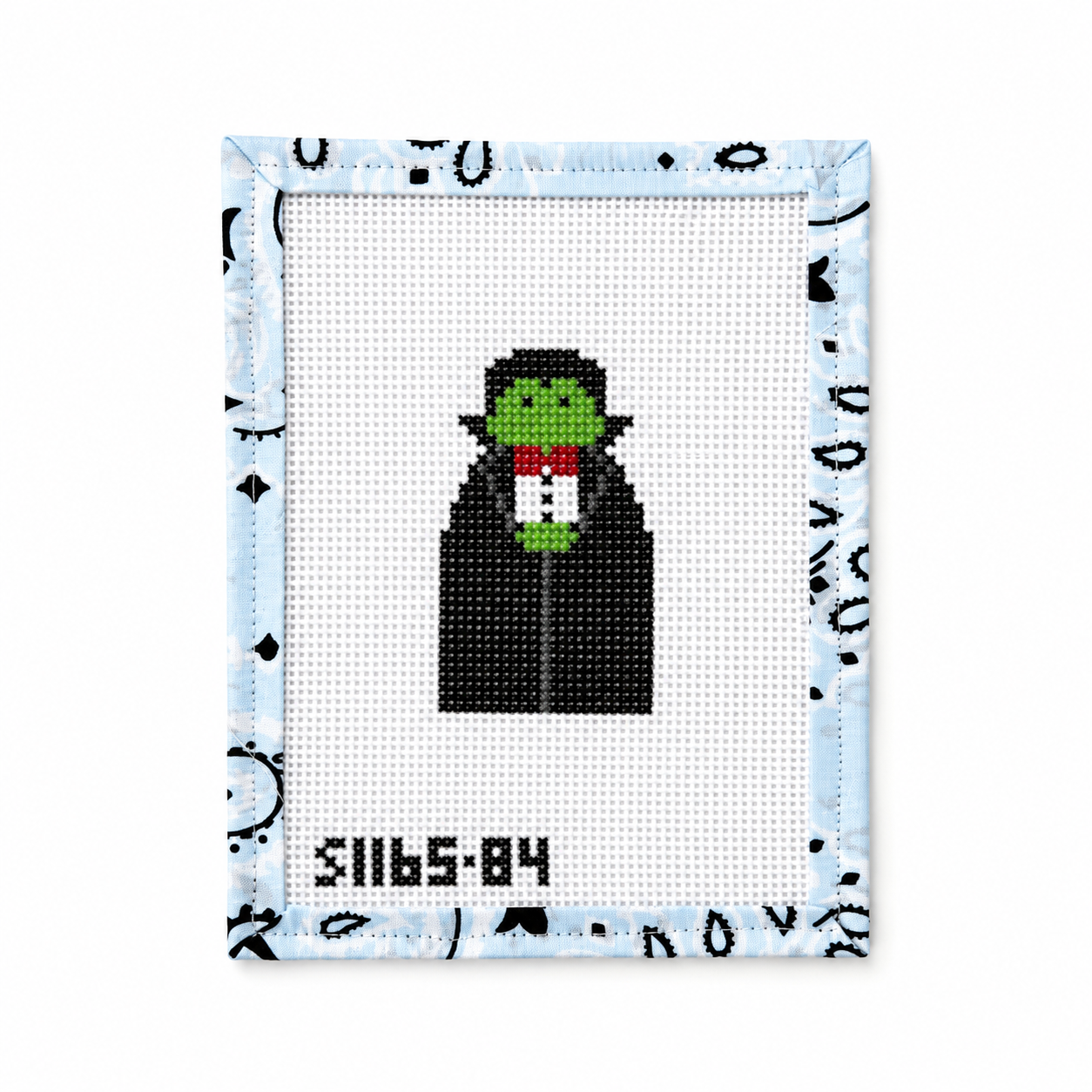 Hand-painted Dracula needlepoint canvas by KCN Designers. 13 mesh, 2.25 x 3". Threads not included. Shop premium Halloween canvases.