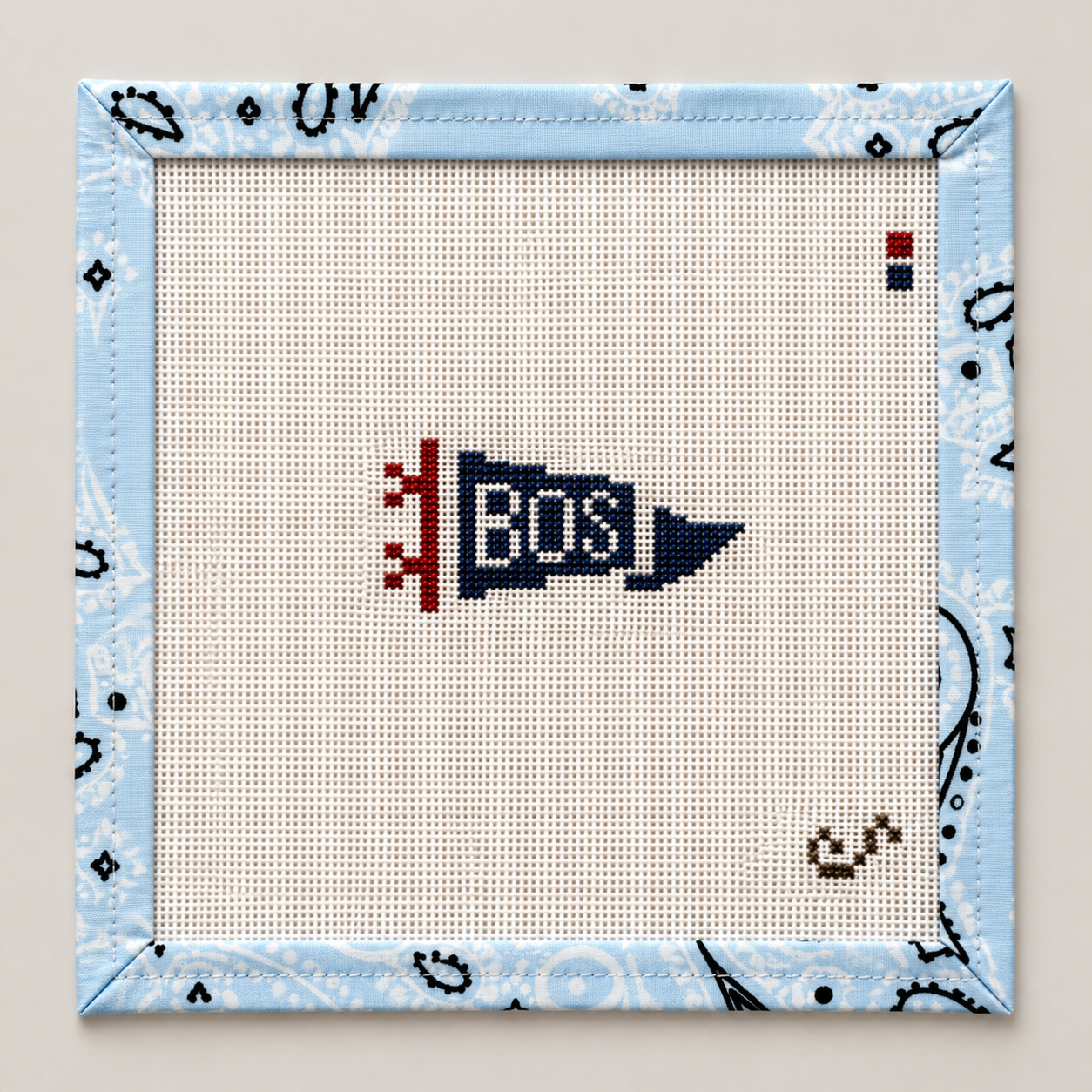 Hand-painted Mini Boston "BOS" pennant needlepoint canvas by Sunday Shoppe. 18 mesh, 1.5x2.5" design. Threads not included. Shop premium canvases.