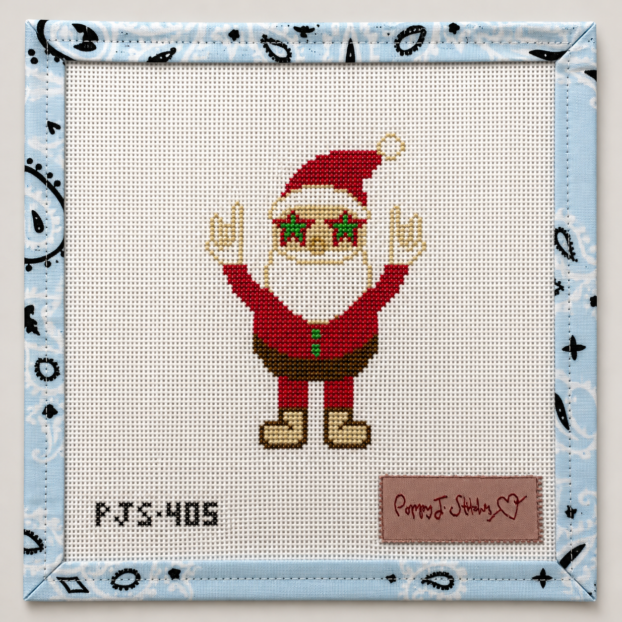 Hand-painted Influencer Santa needlepoint canvas by Poppy J Stitches. 18 mesh, 2.5x3.5" design. Threads not included. Shop premium Christmas canvases.