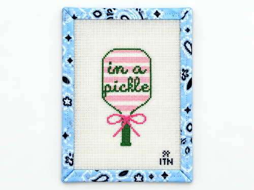 Stitch the playful In a Pickle pickleball racket needlepoint canvas by Ivy Thread. The design measures 4.4 x 2.25 inches; threads are not included.