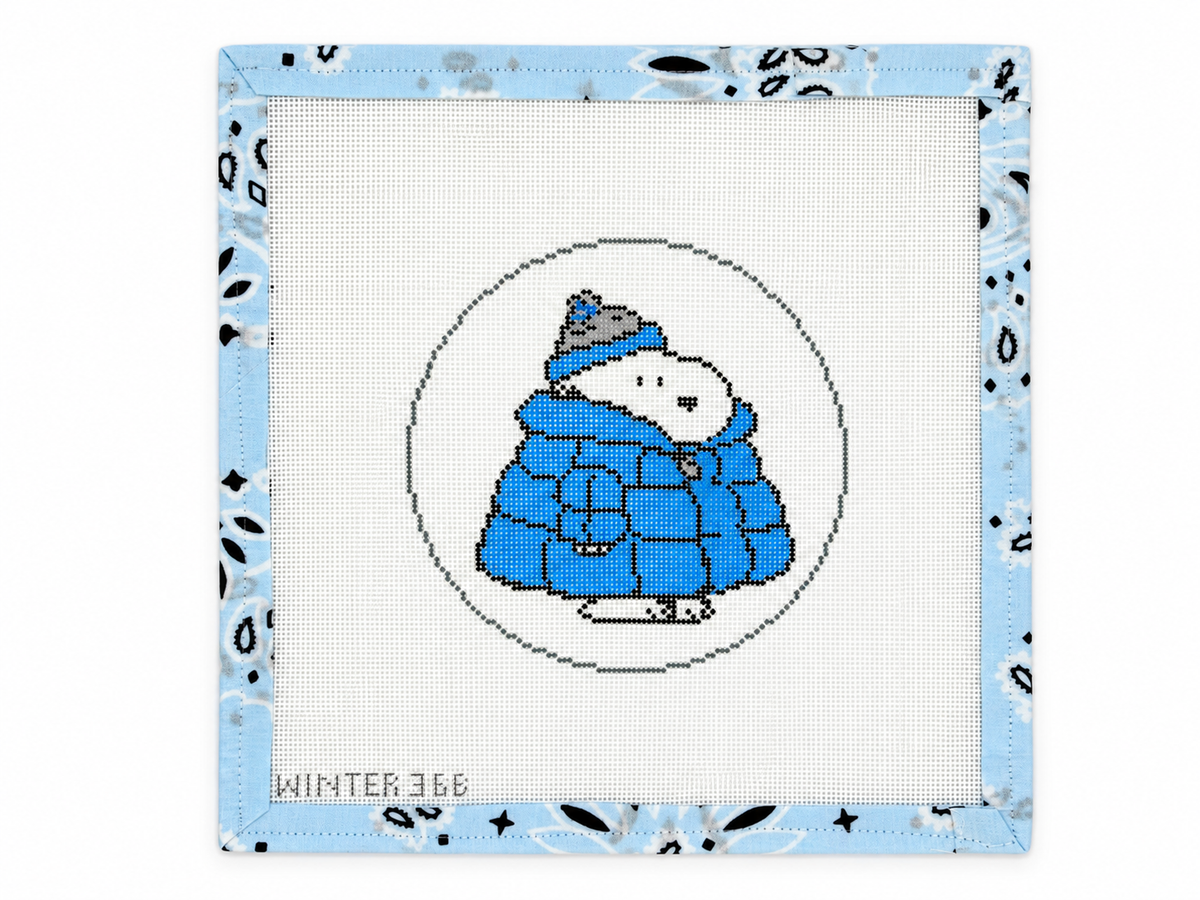 PEANUTS Snoopy in a blue and grey puffer coat by Officially Needlepoint. 5-inch round needlepoint canvas on 18 mesh. Threads not included.
