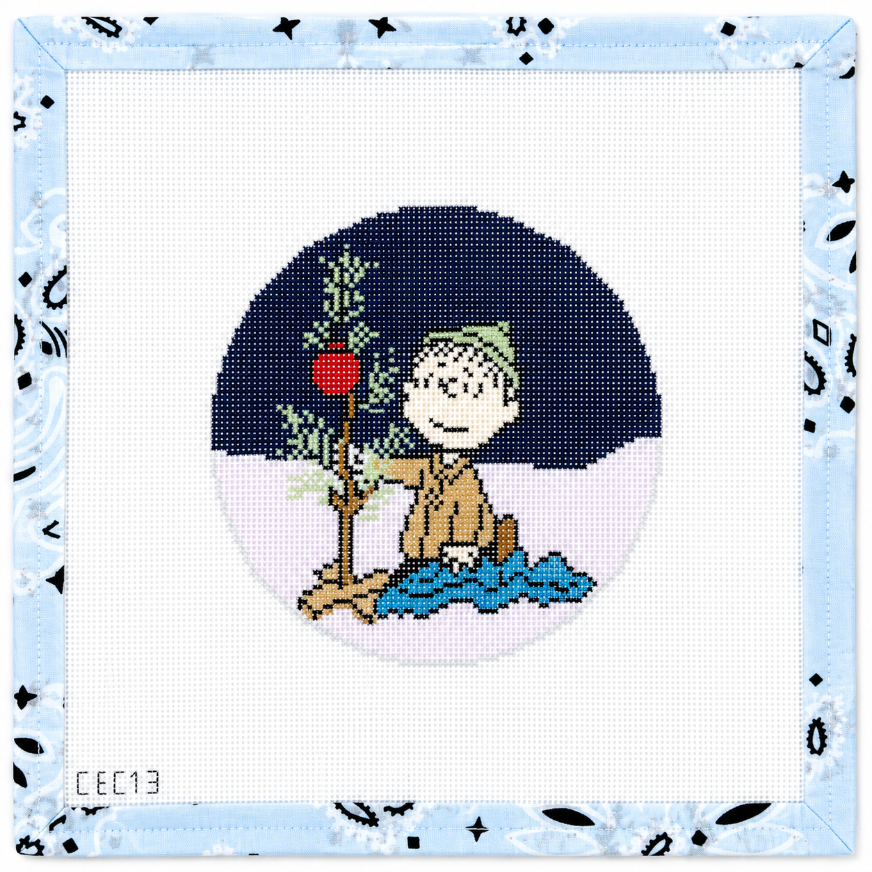 PEANUTS "A Charlie Brown Christmas" - Linus Kneeling wrapping blanket around tiny tree round