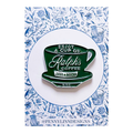 Enamel pin of a green coffee cup with text on a decorative card