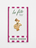 Keep your needle close with the adorable Party Goose Needle Minder, designed to accompany La Fete Party Animal needlepoint canvases. A charming and practical stitching accessory.