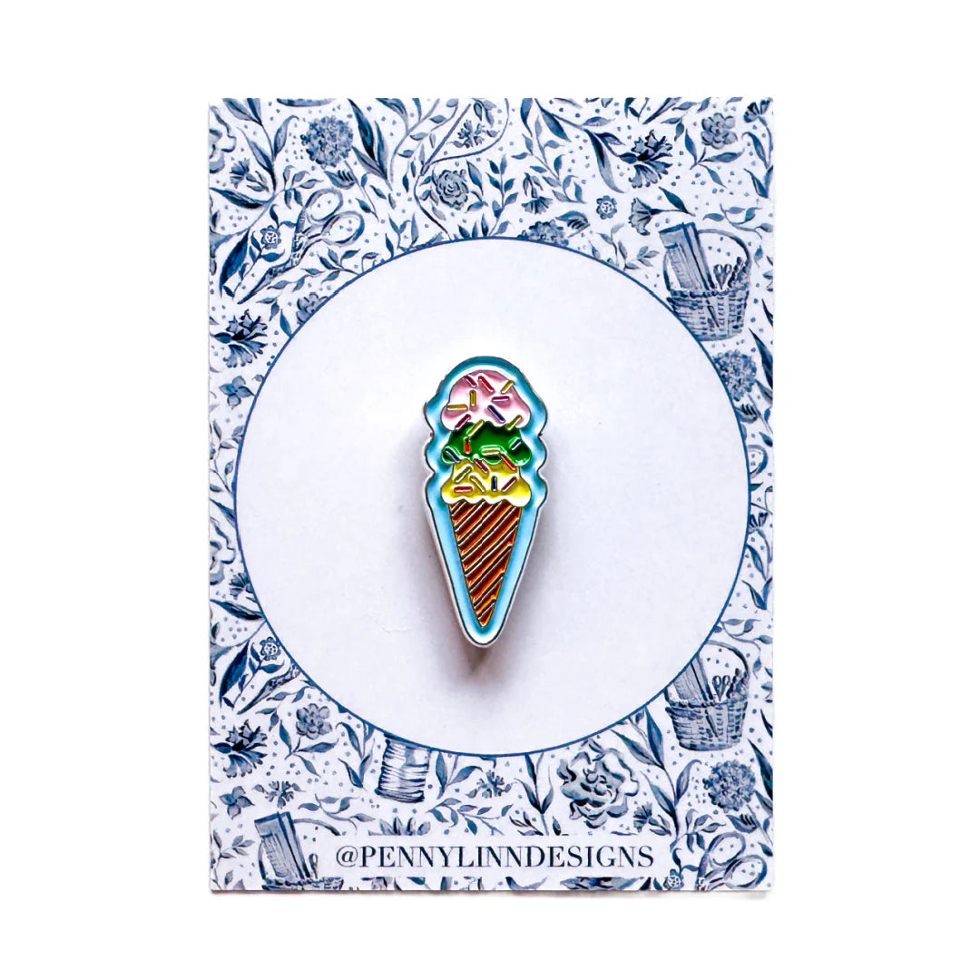 Colorful ice cream cone pin on a floral card with 'Penny Linn Designs' branding.