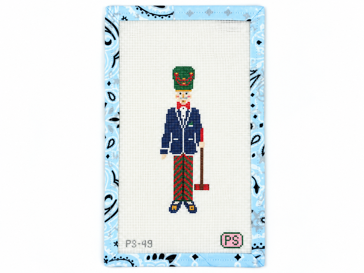 Preppy Nutcracker needlepoint canvas by Prepsetter, stitch-painted by hand on Zweigart, 18 mesh, 10" x 6" canvas. Threads sold separately.