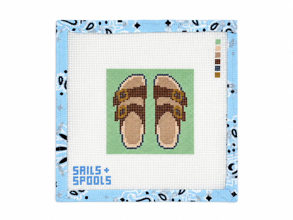 Birks needlepoint canvas by Sails & Spools, inspired by the Birkenstock sandal. Hand-painted on 13 mesh with a 4 x 4-inch design. Threads not included.