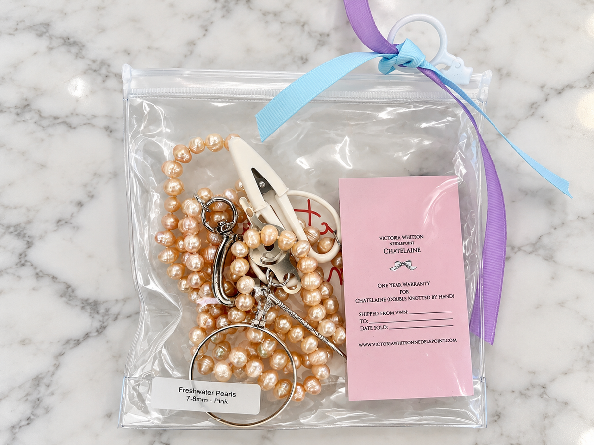  Shop Victoria Whitson's 36-inch hand-knotted light pink freshwater pearl chatelaine with scissors, 5X magnifier, laying tool, thread cutter and threader.